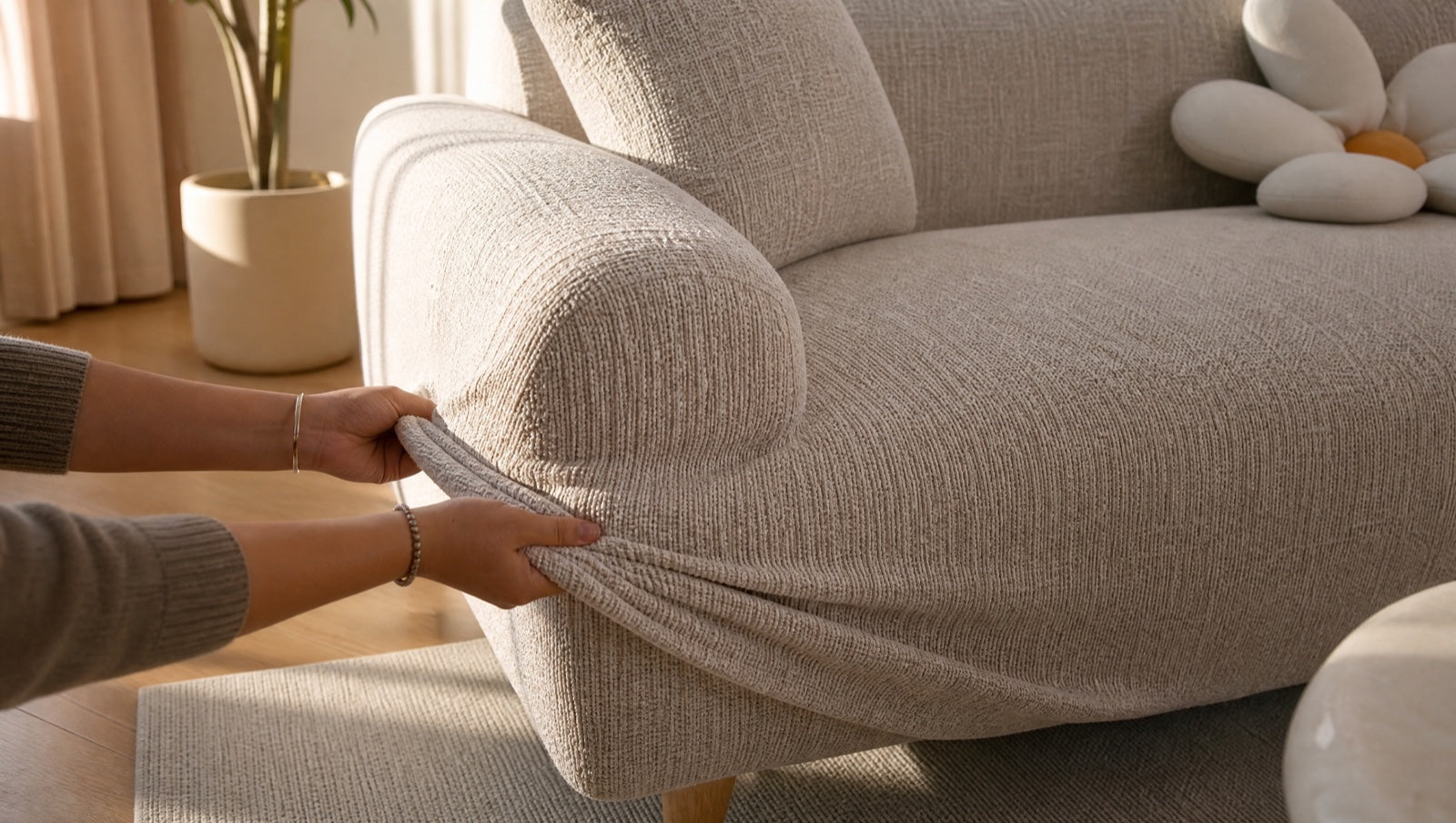 A sofa refreshed with a fitted cover in a bright living room